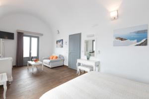 Łóżko lub łóżka w pokoju w obiekcie Hotel Star Santorini