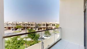 an apartment balcony with a view of a parking lot at Primestay - Odora 6BR, Akoya Oxygen in Dubai