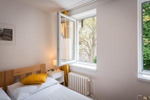 Postel nebo postele na pokoji v ubytování Self-service Hotel Ostaš Praha + 37 fotografií