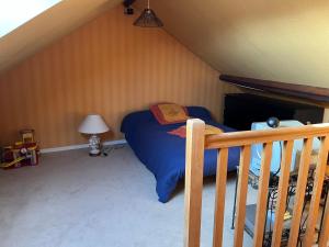 a small bedroom with a bed in a attic at Le Mans Kleber in Le Mans