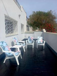 a group of chairs sitting on a patio at Casa La Pita in El Pozo de los Frailes