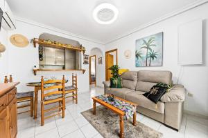 Posezení v ubytování Apartament pod Palmami /Bajo las Palmeras