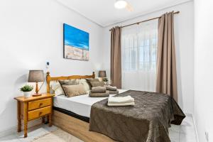 Postel nebo postele na pokoji v ubytování Apartament pod Palmami /Bajo las Palmeras + 56 fotografií