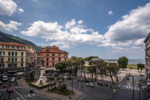 a street in a city with cars and buildings at Sea View Luxury Apartment in Castellammare di Stabia