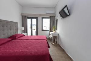 Łóżko lub łóżka w pokoju w obiekcie Hotel Star Santorini