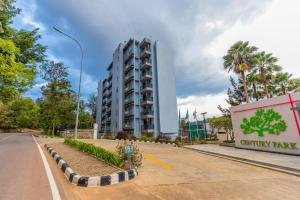 a building in the middle of a street with a road at Century Park Hotel & Residences in Kigali