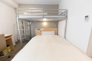 Postel nebo postele na pokoji v ubytování Super Hotel Tokyo Otsuka