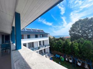 a view from the balcony of a building with chairs at Vila Ithea in 2 Mai