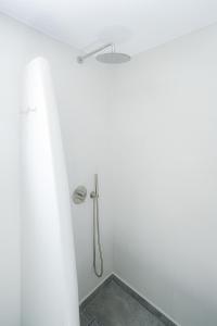 Ванная комната в Thoè Oia Suites
