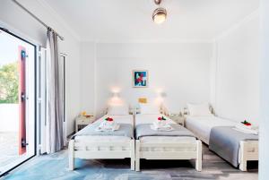 Ένα ή περισσότερα κρεβάτια σε δωμάτιο στο Irene Hotel - Beachfront