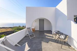 Балкон или терраса в Thoè Oia Suites