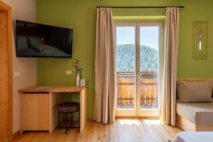 TV a/nebo společenská místnost v ubytování Villa Gottfried B&B