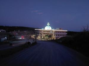 a building with a dome on top of it at night at Homestay tay in Xã Trảng Bôm