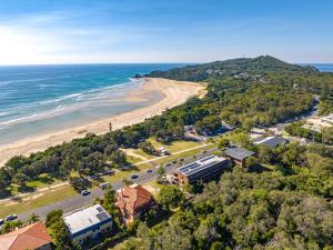 an aerial view of a beach and the ocean at Coastal SOL -Right on Clarkes Beach! in Byron Bay