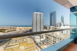 a view of the city from the balcony of a building at The Zen Tower - Vacationer in Dubai