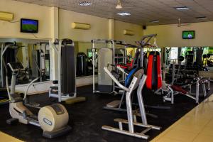a gym with several treadmills and cardio machines at Grand Hotel Juba in Juba