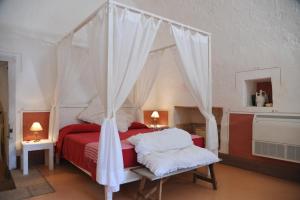 Postel nebo postele na pokoji v ubytování Masseria Cristo