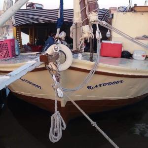 a boat tied up to a dock with a rope at Sailing boat in Aswan