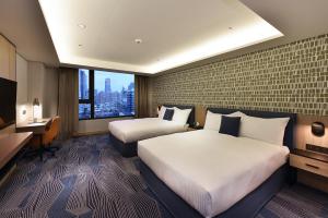 Ліжко або ліжка в номері Fullon Poshtel - Kaohsiung