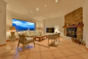 Telewizja i/lub zestaw kina domowego w obiekcie Villas Guzman - BELLISSIMA