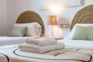 Łóżko lub łóżka w pokoju w obiekcie Villas Guzman - BELLISSIMA