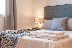 Łóżko lub łóżka w pokoju w obiekcie Villas Guzman - BELLISSIMA