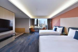Ліжко або ліжка в номері Fullon Poshtel - Kaohsiung