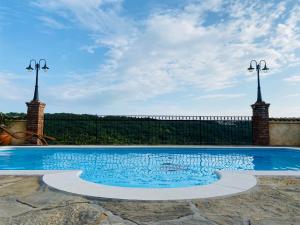 a swimming pool on top of a house at Dobrinja Residence Villas Lopar in Marezige