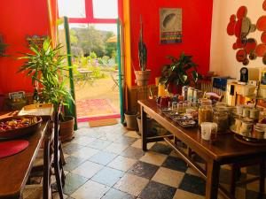 a room with a table with food on it at Aux couleurs de Commarin CHAMBRES d'hôtes in Commarin