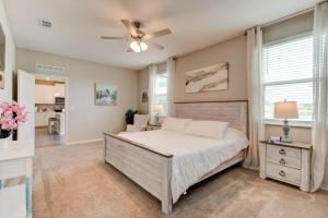 a bedroom with a bed and a ceiling fan at New St Augustine Waterview Home in Saint Augustine