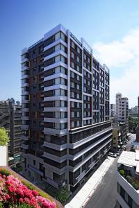 a rendering of a tall apartment building at Fullon Poshtel - Kaohsiung in Kaohsiung