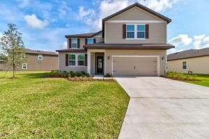 a house with a driveway and a garage at New St Augustine Waterview Home in Saint Augustine