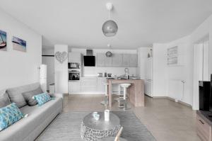 Een keuken of kitchenette bij La Marquette - Appartement avec balcon