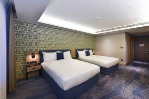Ліжко або ліжка в номері Fullon Poshtel - Kaohsiung