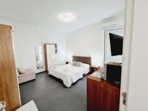 A bed or beds in a room at Medusa room apartment