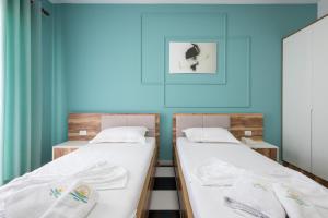 Postel nebo postele na pokoji v ubytování Compas Boutique Hotel