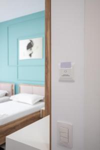 Postel nebo postele na pokoji v ubytování Compas Boutique Hotel