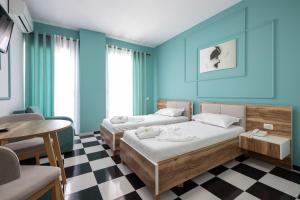 Postel nebo postele na pokoji v ubytování Compas Boutique Hotel