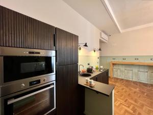 Kuchyň nebo kuchyňský kout v ubytování Be Your Home - Guest House Fuori Dal Porto
