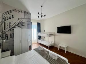 TV a/nebo společenská místnost v ubytování Be Your Home - Guest House Fuori Dal Porto