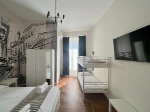 Postel nebo postele na pokoji v ubytování Be Your Home - Guest House Fuori Dal Porto