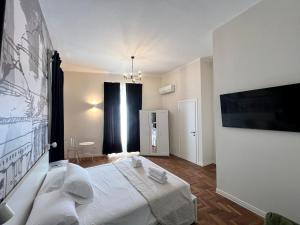 Postel nebo postele na pokoji v ubytování Be Your Home - Guest House Fuori Dal Porto