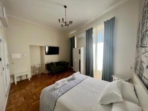 Postel nebo postele na pokoji v ubytování Be Your Home - Guest House Fuori Dal Porto