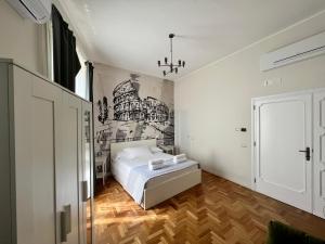 Postel nebo postele na pokoji v ubytování Be Your Home - Guest House Fuori Dal Porto