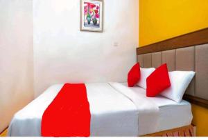 Ein Bett oder Betten in einem Zimmer der Unterkunft Hotel Jerai Ct Inn