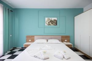 Postel nebo postele na pokoji v ubytování Compas Boutique Hotel