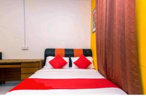Ein Bett oder Betten in einem Zimmer der Unterkunft Hotel Jerai Ct Inn