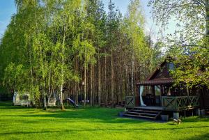 a park with a gazebo in the grass at Domek na Skarpie in Miłomłyn