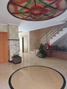 a lobby with a large painting on the ceiling at Costa Caribe III Nº 1108 in Oropesa del Mar