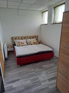 Posteľ alebo postele v izbe v ubytovaní Apartmán pri Sokolovni